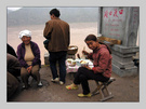 贺江湖改版，贴一组老片：碛口听涛 [黄河岸边，一个小摊主在做着时有时无的小生意，旁边就是下像棋的那群人